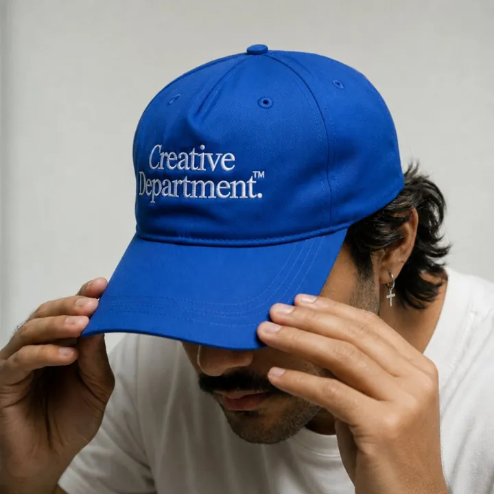tanishq bodh, founder of chain ink, adjusting a blue cap